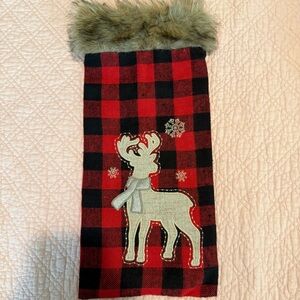 Festive Red and Black Checkered Stocking with Reindeer Design